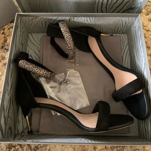 Limited edition, brand new Alexander McQueen black and gold heels